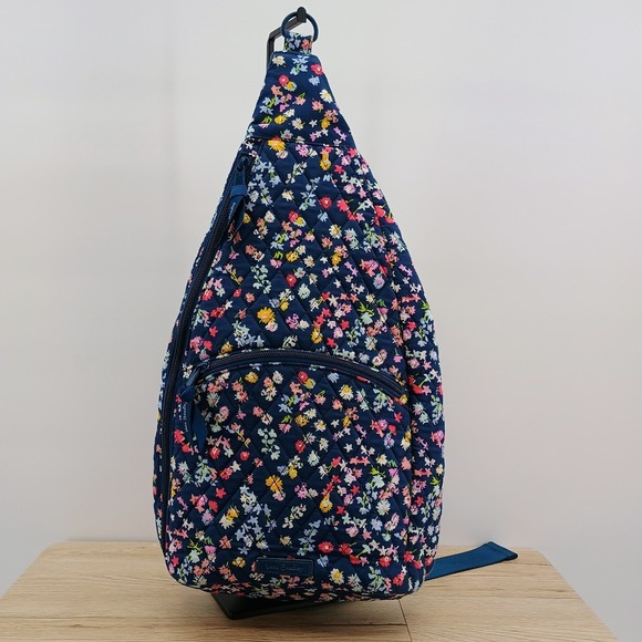 Vera Bradley Handbags - Vera Bradley Essentials Sling Backpack Scattered Wildflowers Navy Blue Quilted